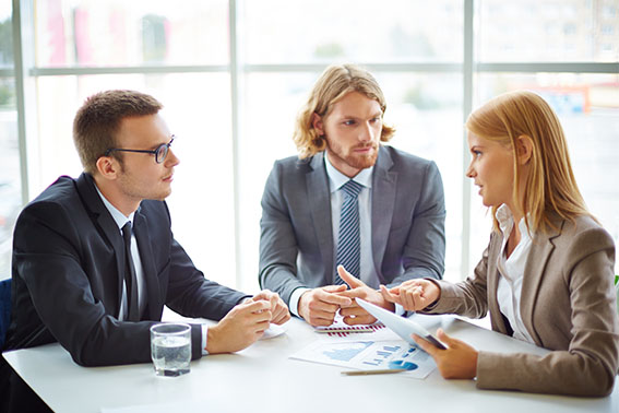 Male employee holding business papers
